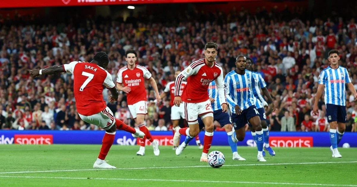 Saka taking a shot during Arsenal match Saka taking a shot during Arsenal match