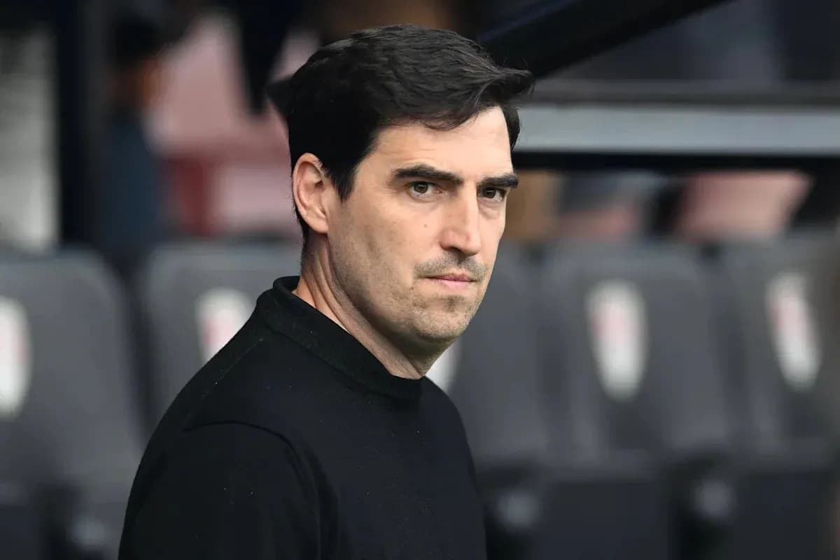 Manager observing the match from the sidelines Manager observing the match from the sidelines