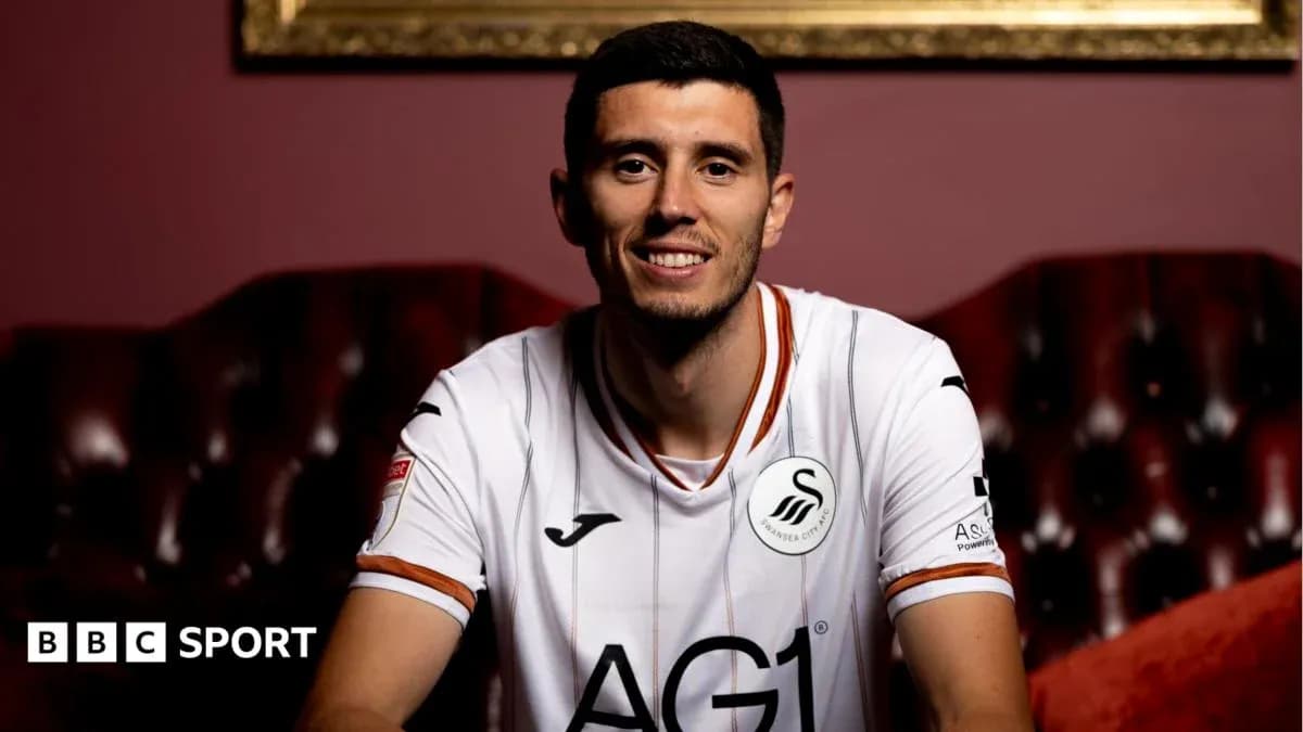 Player wearing Swansea City jersey in studio setting Player wearing Swansea City jersey in studio setting