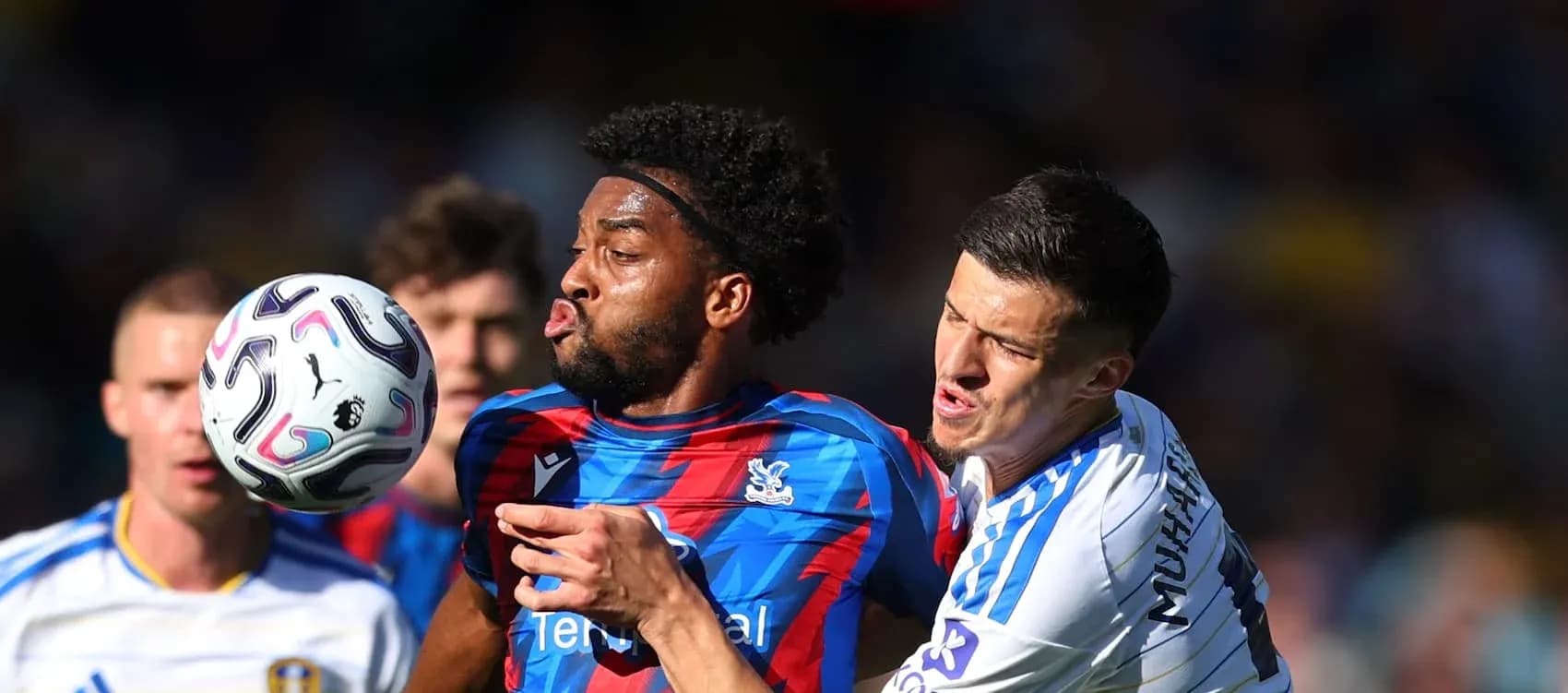 Player from Crystal Palace battling for the ball Player from Crystal Palace battling for the ball