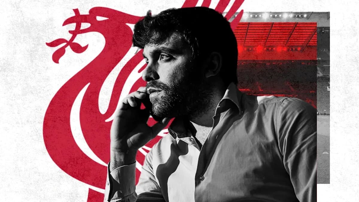 Man on phone with Liverpool FC logo background Man on phone with Liverpool FC logo background