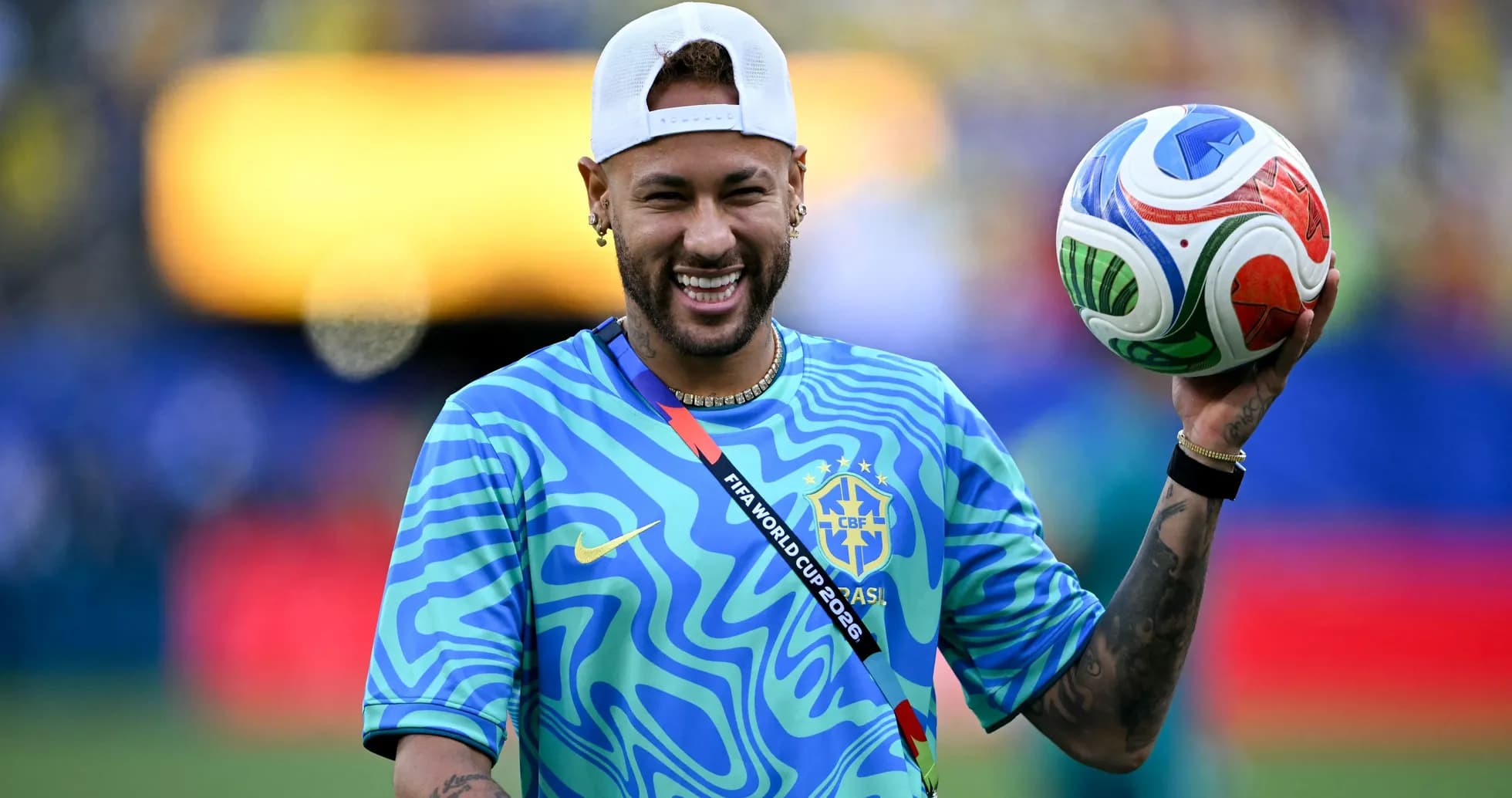 Player holding a soccer ball in team jersey Player holding a soccer ball in team jersey