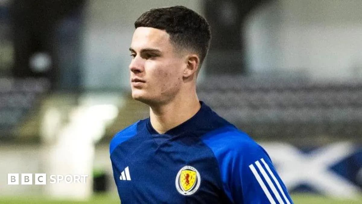 Player in Scotland training kit walking on pitch Player in Scotland training kit walking on pitch