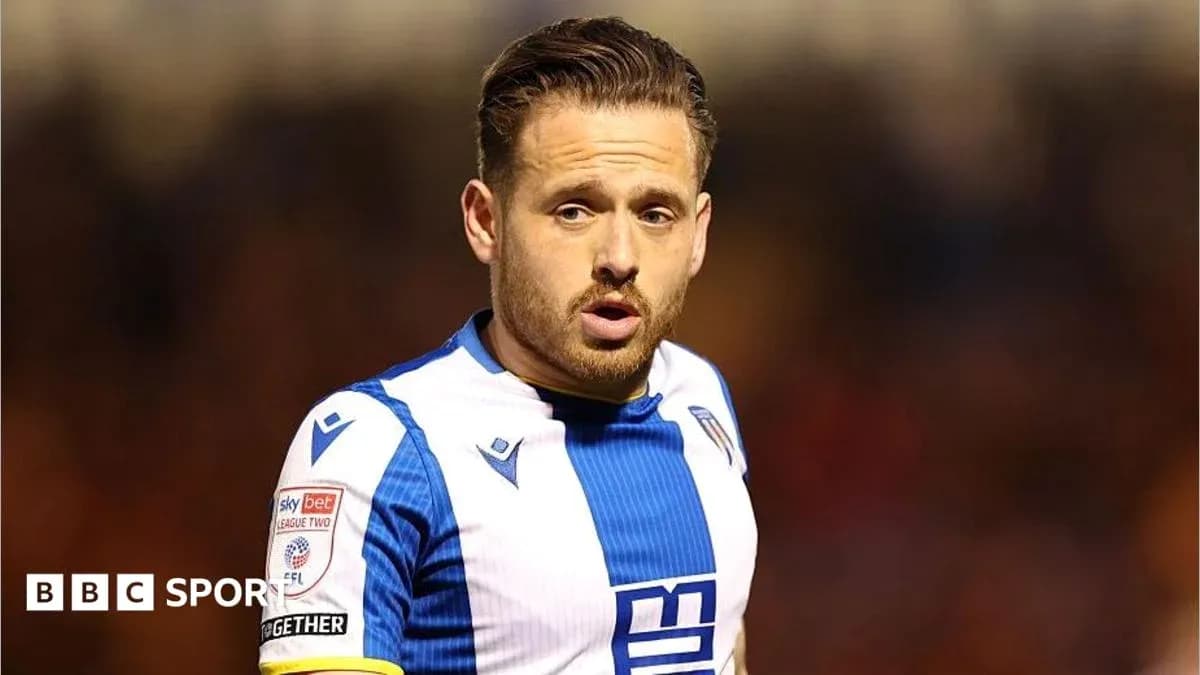Player wearing blue and white kit on field Player wearing blue and white kit on field