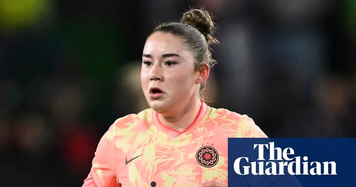 Goalkeeper in bright kit during match action Goalkeeper in bright kit during match action