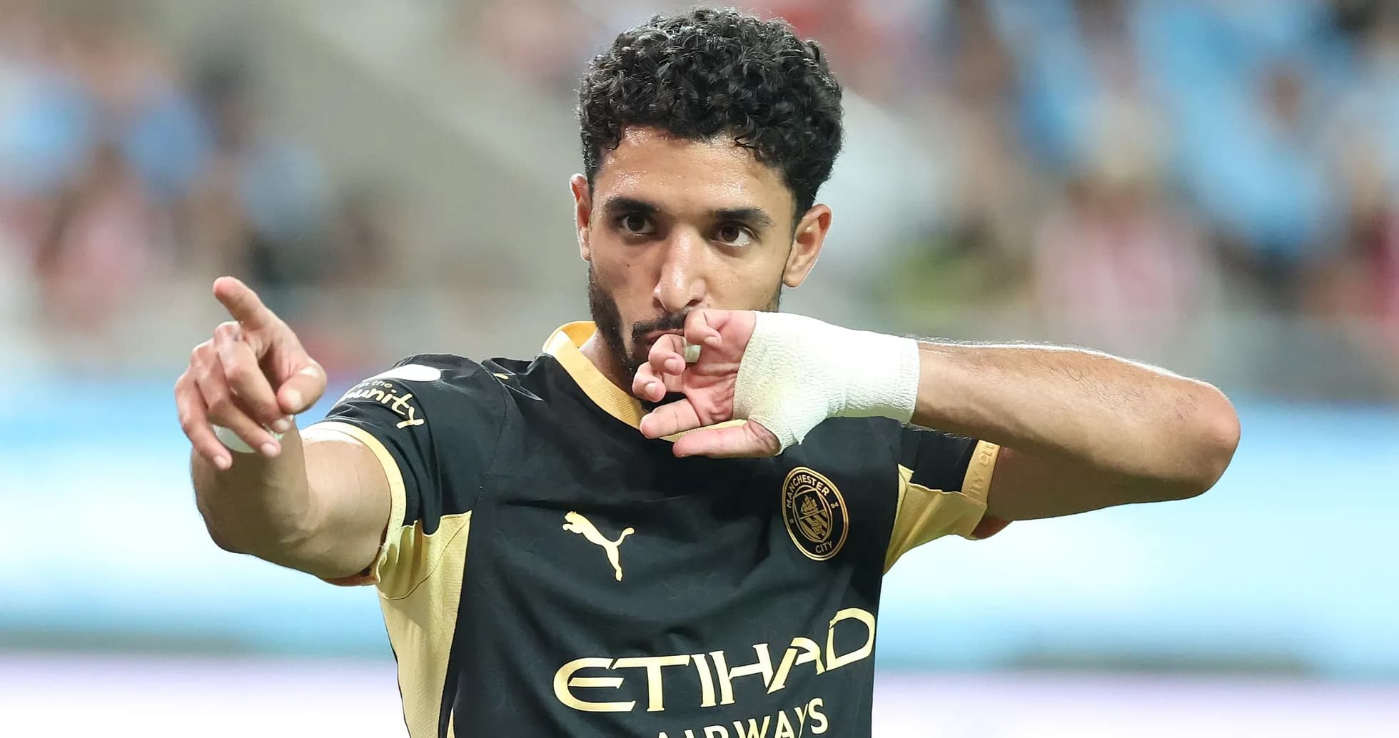 Player celebrating with hand gesture during match Player celebrating with hand gesture during match