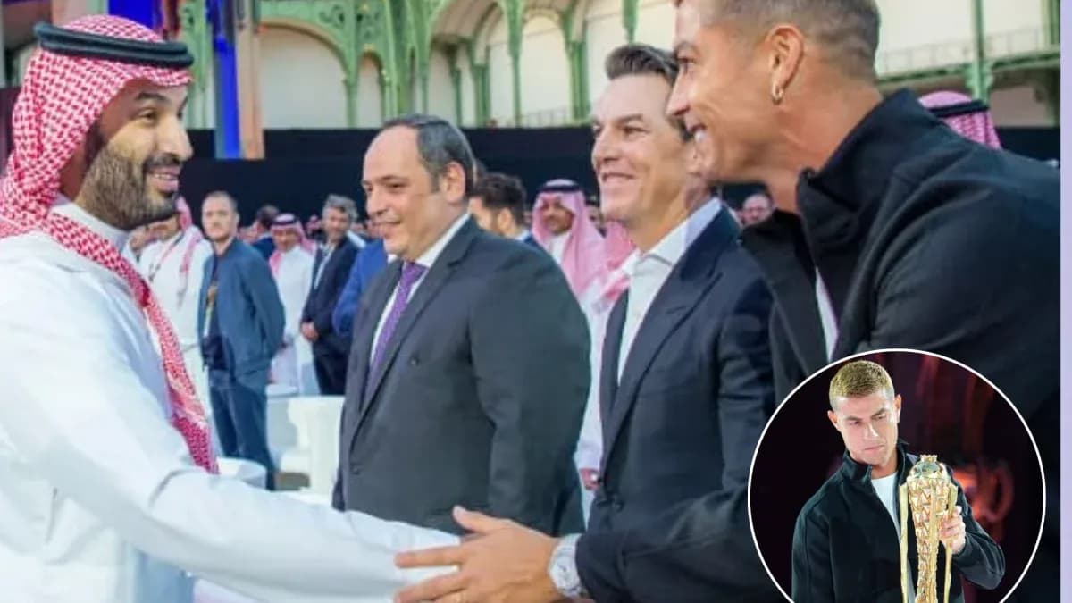 Men shaking hands at an event with audience in background Men shaking hands at an event with audience in background