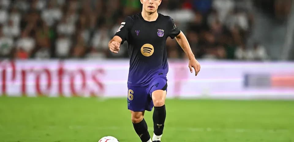 Player dribbling the ball during a match Player dribbling the ball during a match
