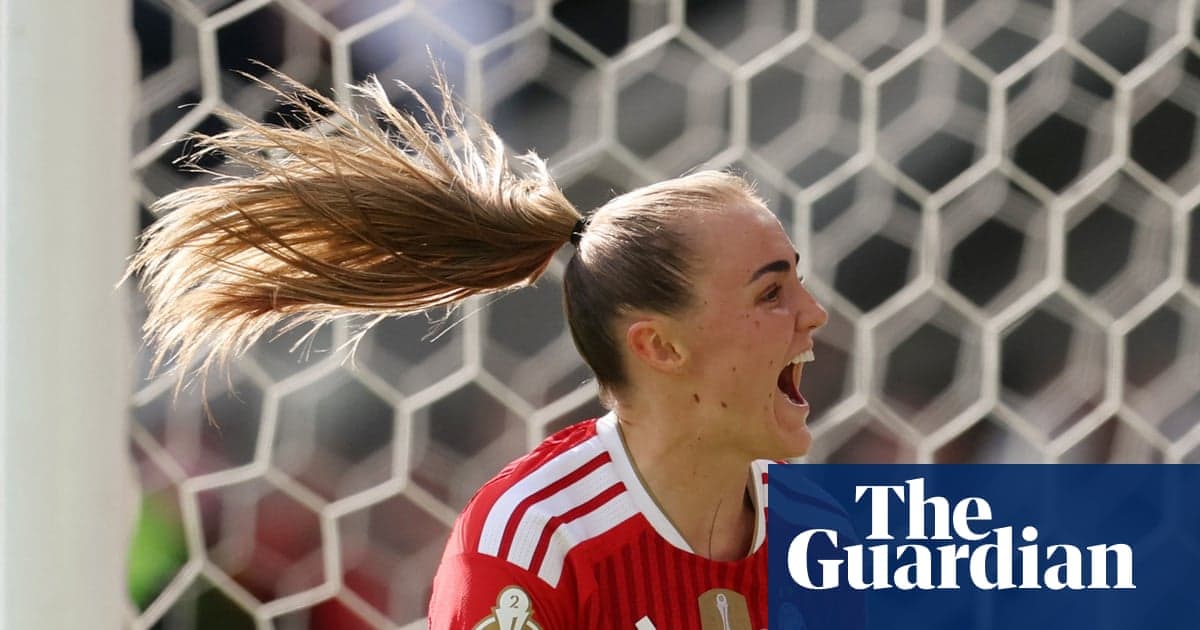 Goalkeeper celebrating a save in front of goal Goalkeeper celebrating a save in front of goal