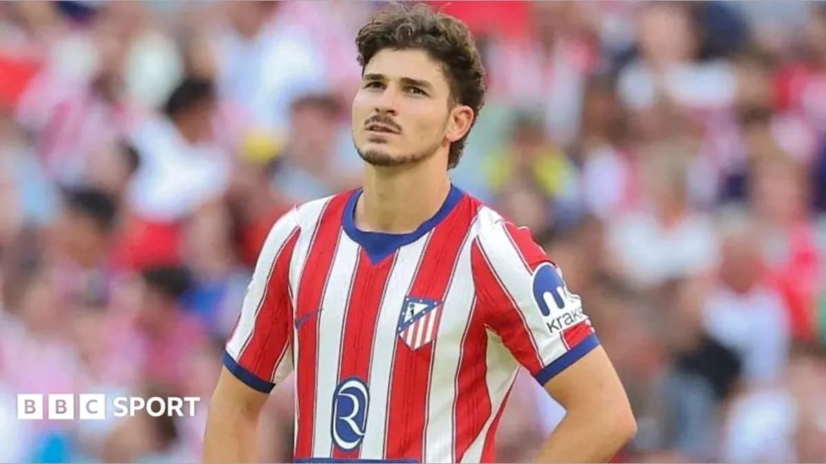 Atletico Madrid player looking pensive on the field Atletico Madrid player looking pensive on the field