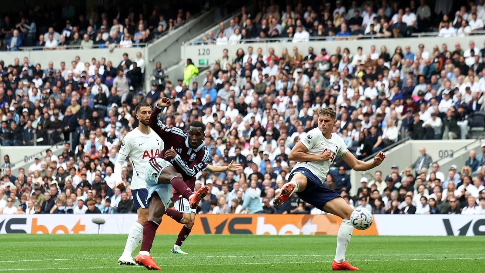 Player kicking the ball during a match Player kicking the ball during a match