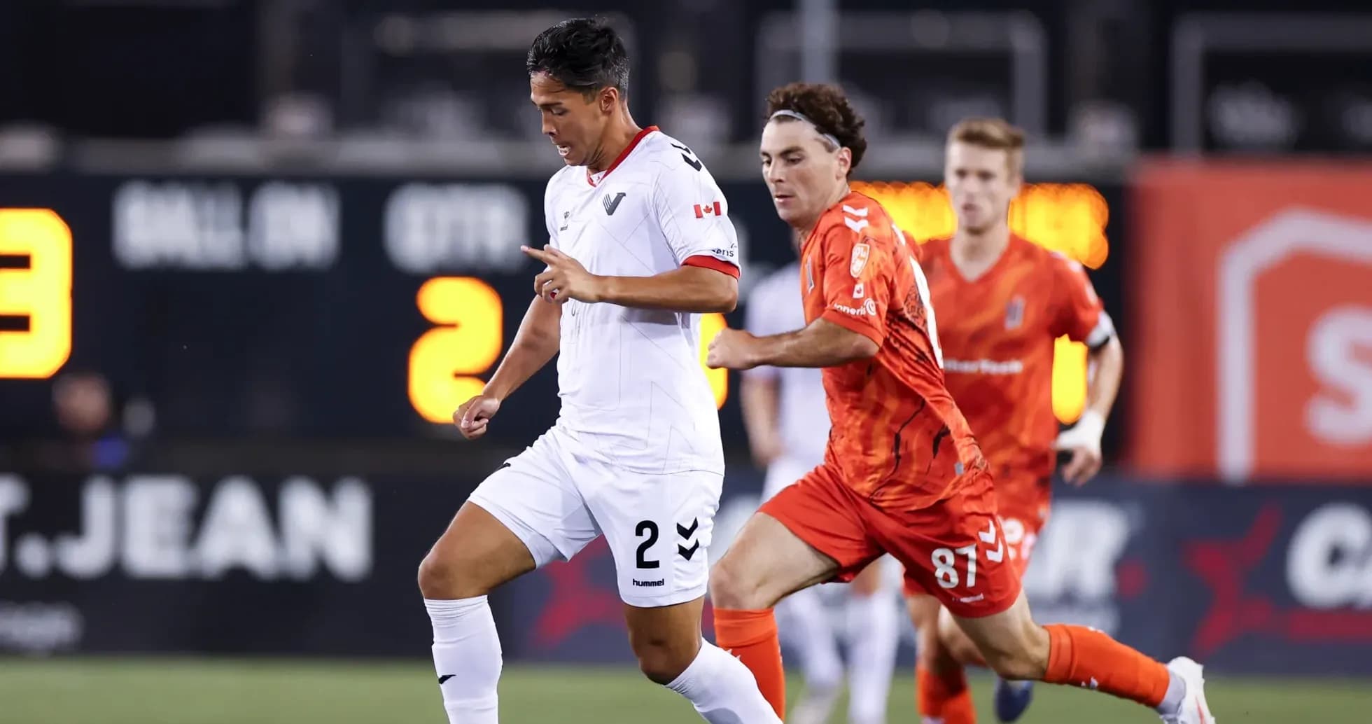 Vancouver FC player dribbling past Forge FC opponent Vancouver FC player dribbling past Forge FC opponent