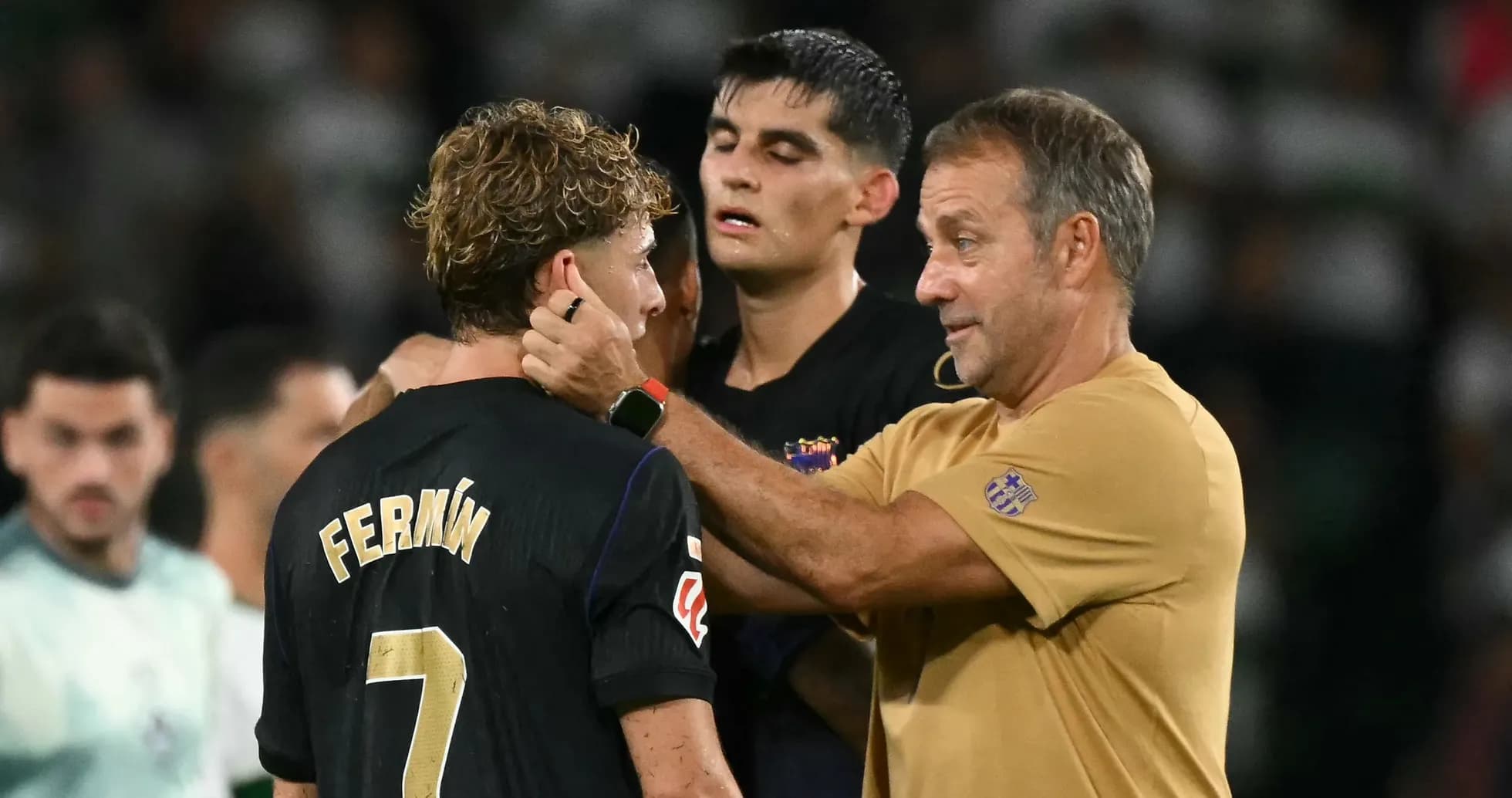 Coach discussing with player after match on field Coach discussing with player after match on field