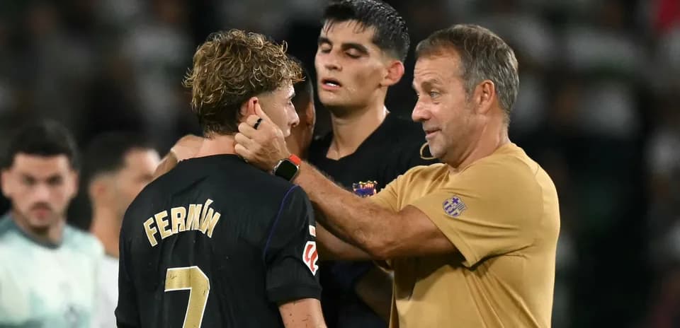 Coach discussing with player after match on field Coach discussing with player after match on field