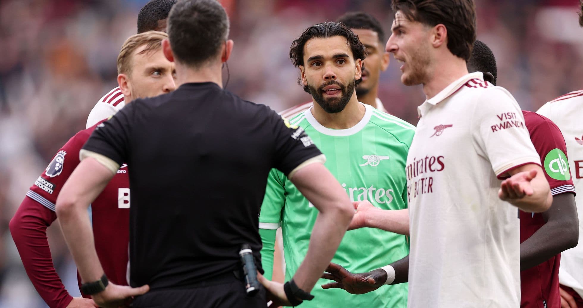 Players discussing with the referee during match Players discussing with the referee during match