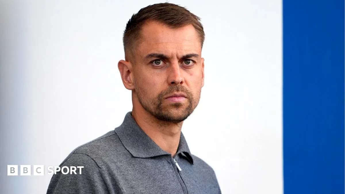 Individual posing for a portrait with neutral background Individual posing for a portrait with neutral background