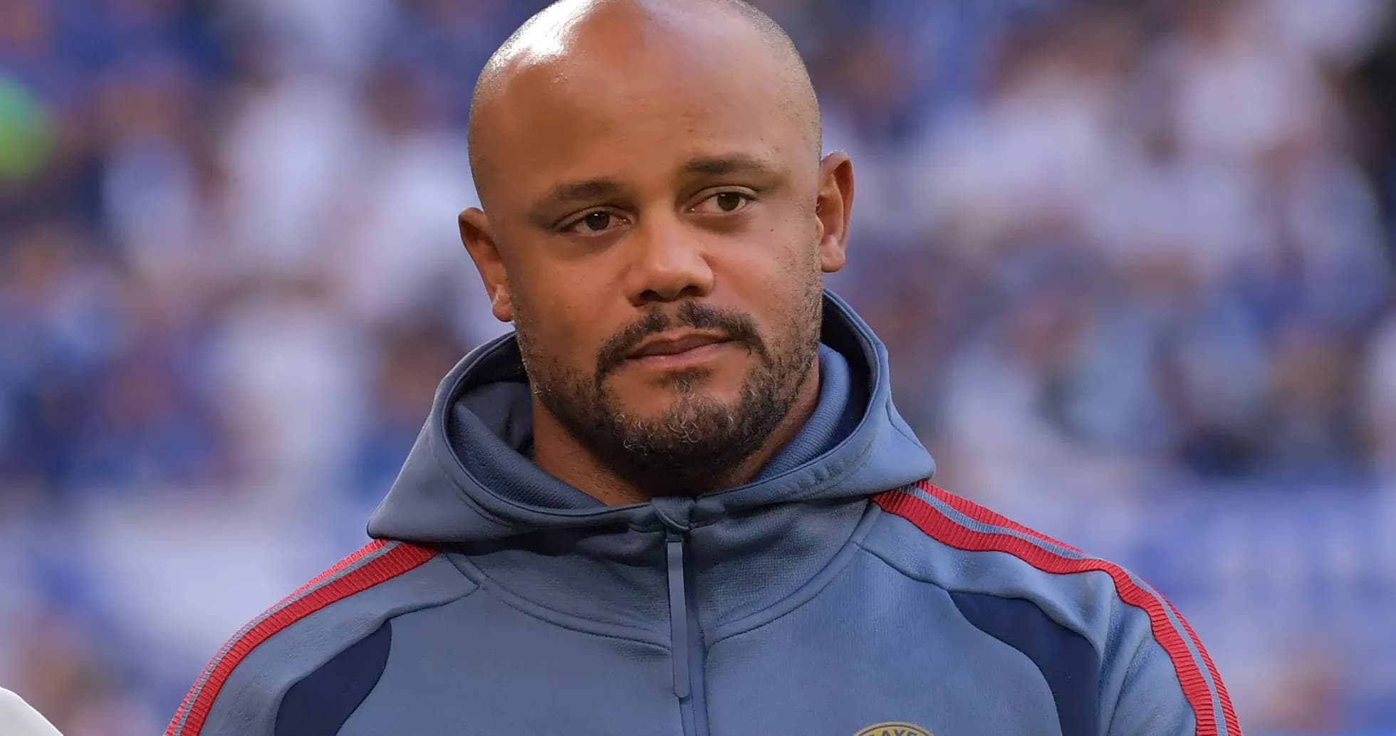 Man in hoodie with FC Bayern Munich logo Man in hoodie with FC Bayern Munich logo