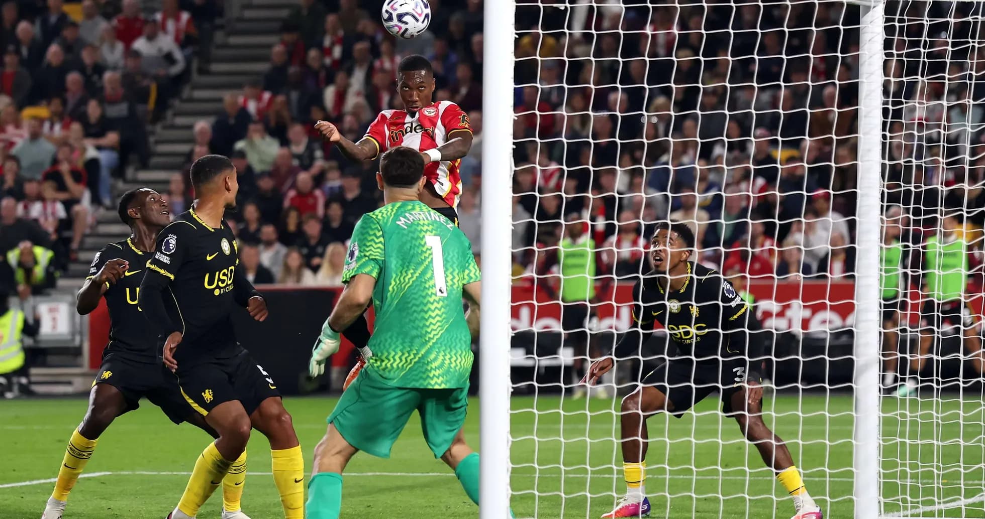 Brentford player heading the ball towards goal Brentford player heading the ball towards goal