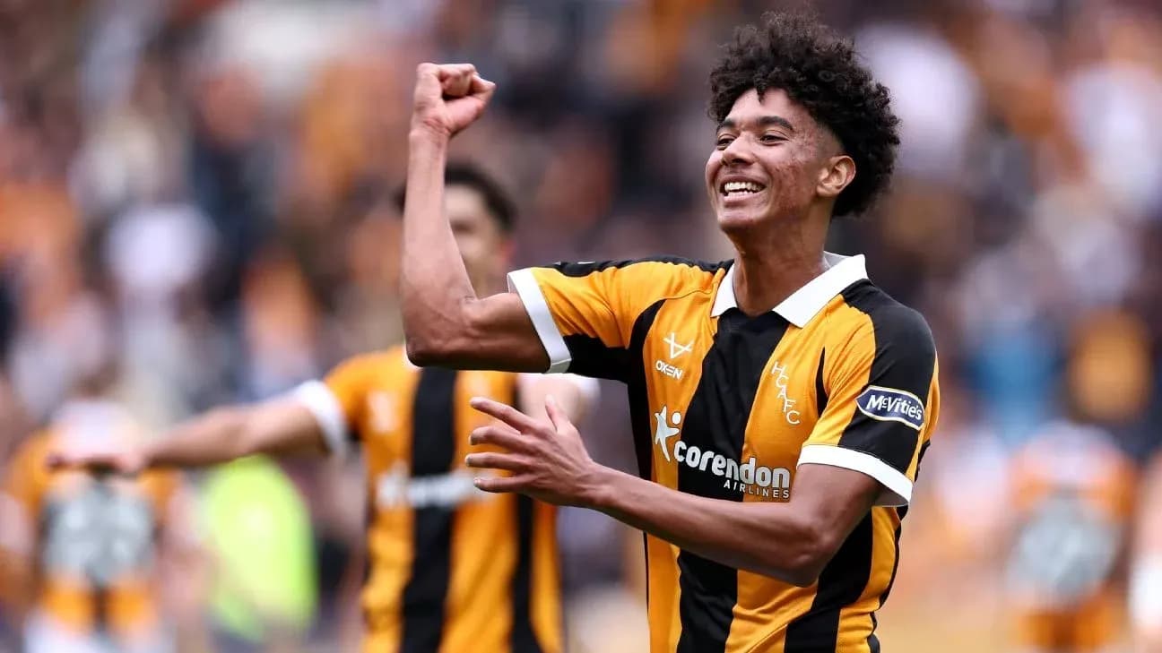Player celebrating a goal in team uniform Player celebrating a goal in team uniform