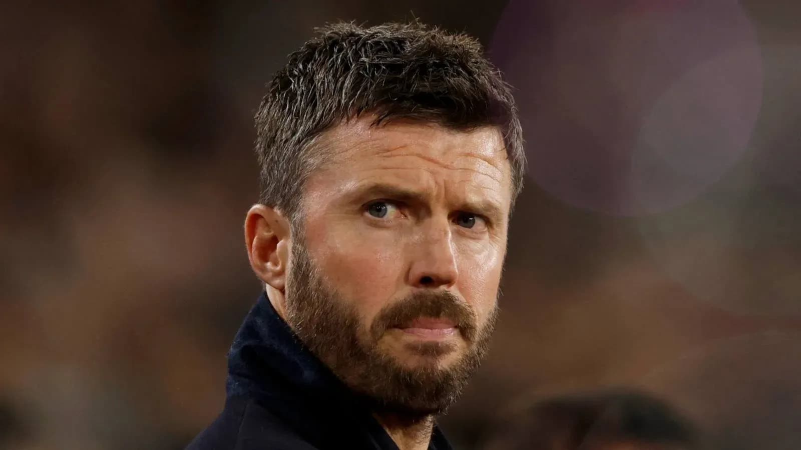 Man with a beard looking intently off-camera Man with a beard looking intently off-camera
