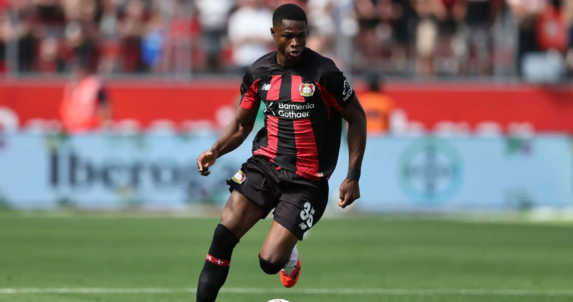 Player dribbling the ball during a match Player dribbling the ball during a match