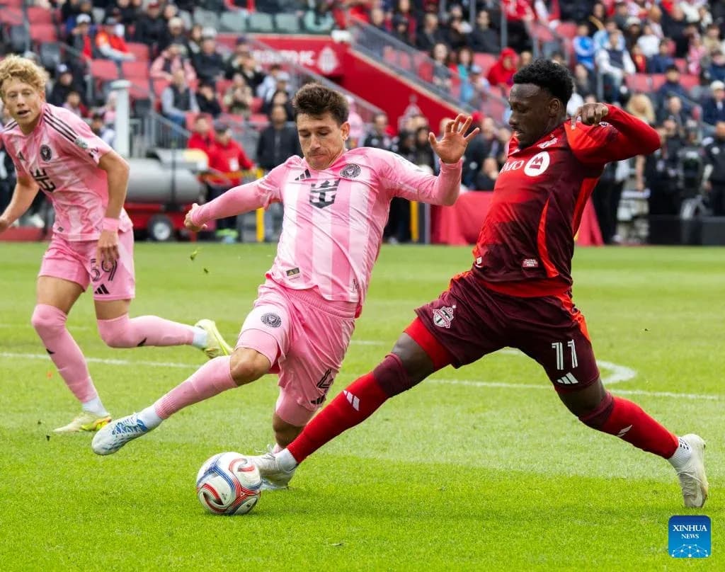 Inter Miami players challenging Toronto FC during match Inter Miami players challenging Toronto FC during match