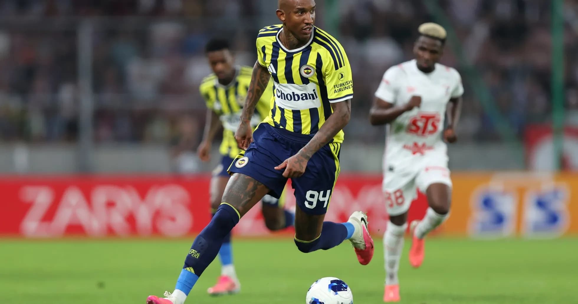 Fenerbahçe player dribbling the ball during match Fenerbahçe player dribbling the ball during match