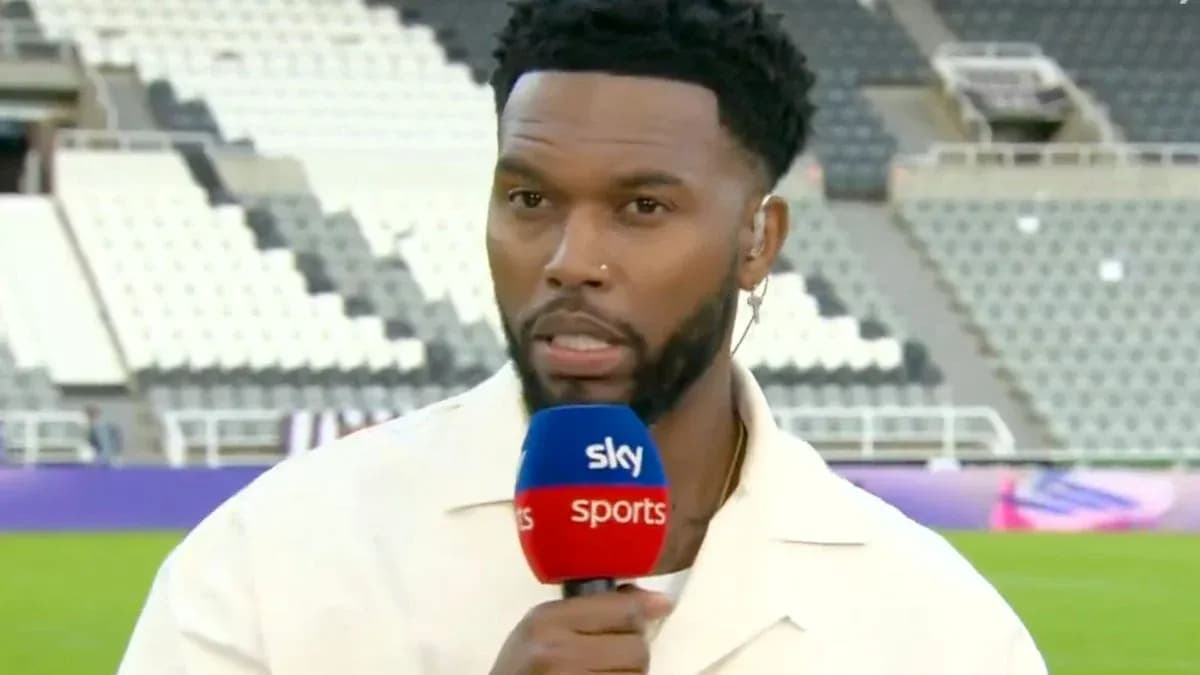 Sports commentator speaking into microphone on field Sports commentator speaking into microphone on field