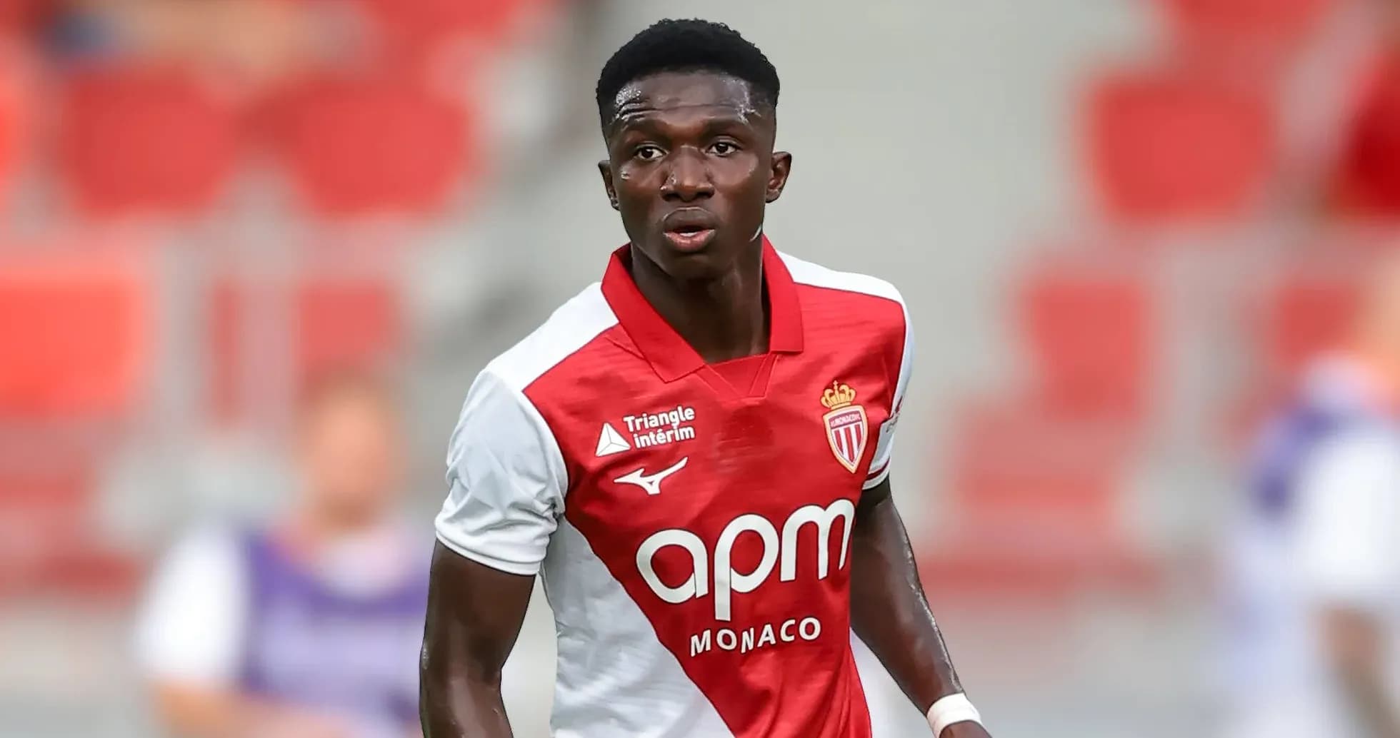 Monaco player in red and white kit on field Monaco player in red and white kit on field