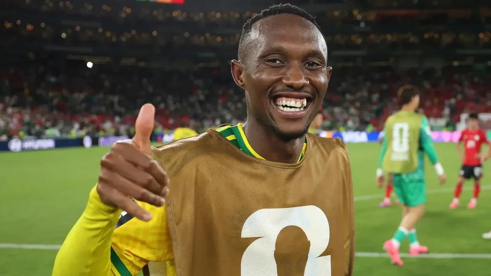 Player celebrating with thumbs up on the field Player celebrating with thumbs up on the field