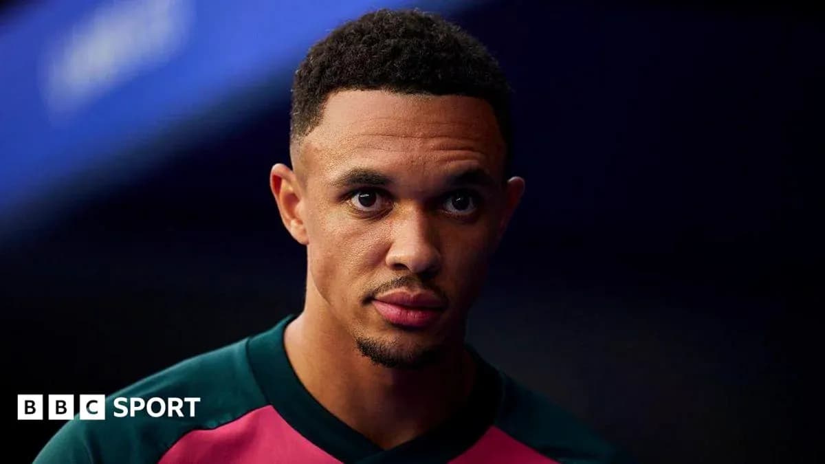Player in team kit looking focused before match Player in team kit looking focused before match