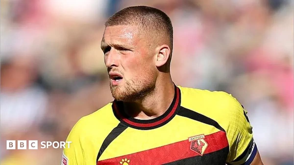 Watford player in yellow and red jersey during match Watford player in yellow and red jersey during match