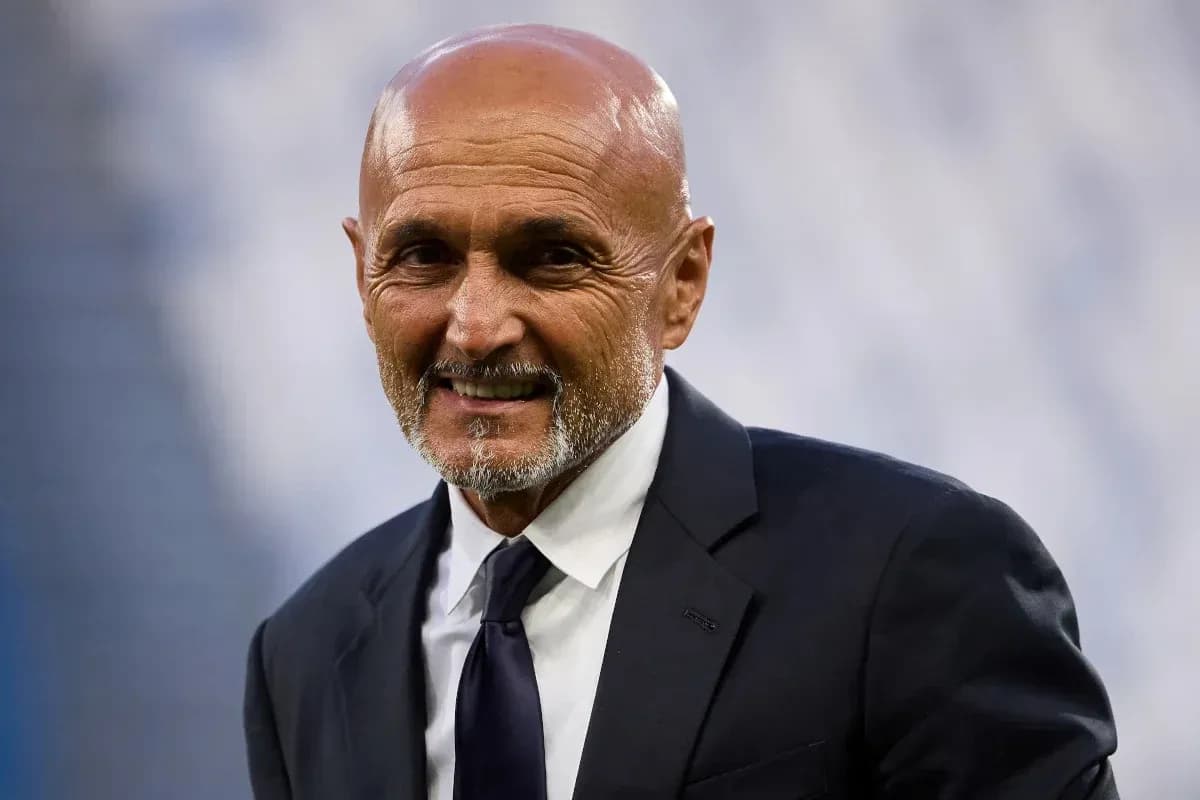 Coach smiling in a suit at stadium Coach smiling in a suit at stadium