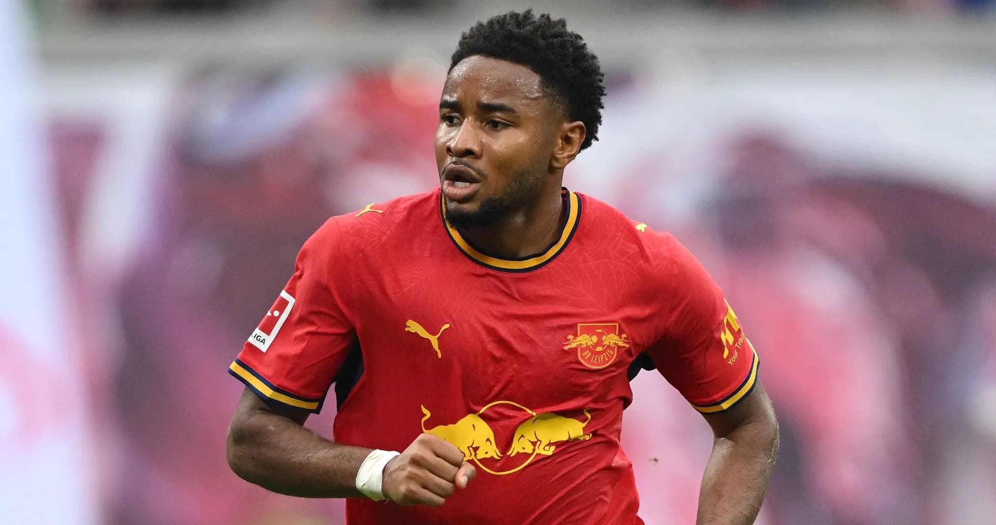 Player running in RB Leipzig red kit during match Player running in RB Leipzig red kit during match