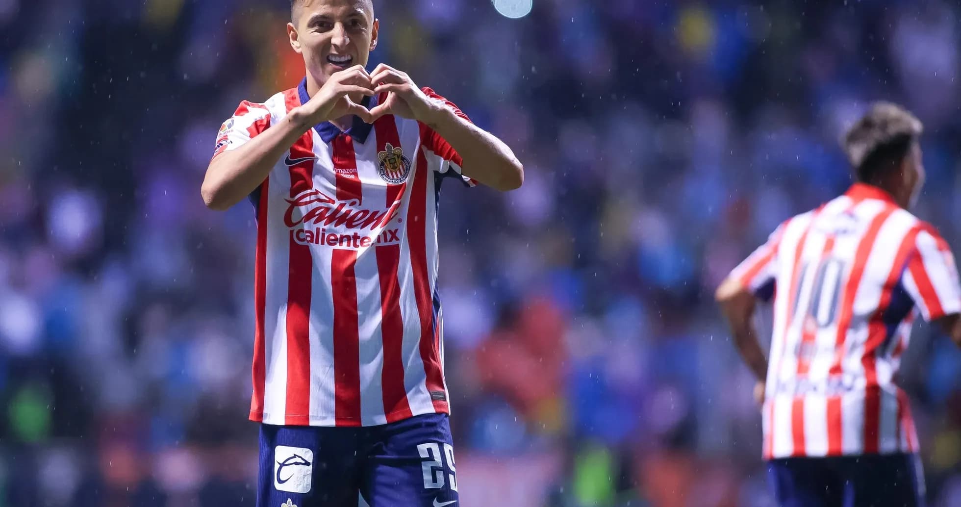 Chivas player celebrating goal during Liga MX match Chivas player celebrating goal during Liga MX match
