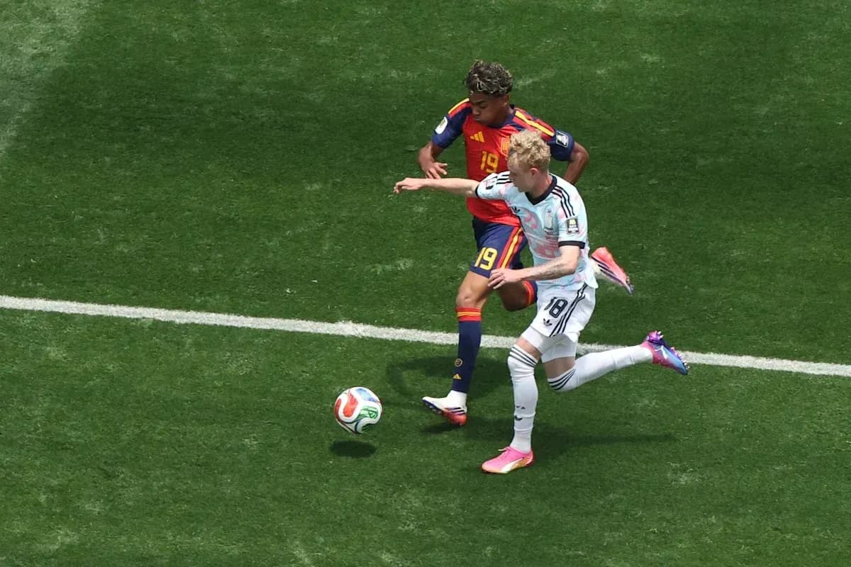 Players contesting the ball during a football match Players contesting the ball during a football match