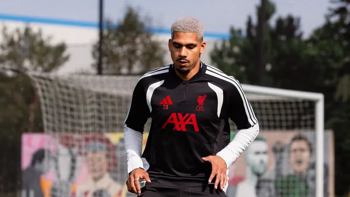 Player training in Liverpool FC kit on pitch Player training in Liverpool FC kit on pitch