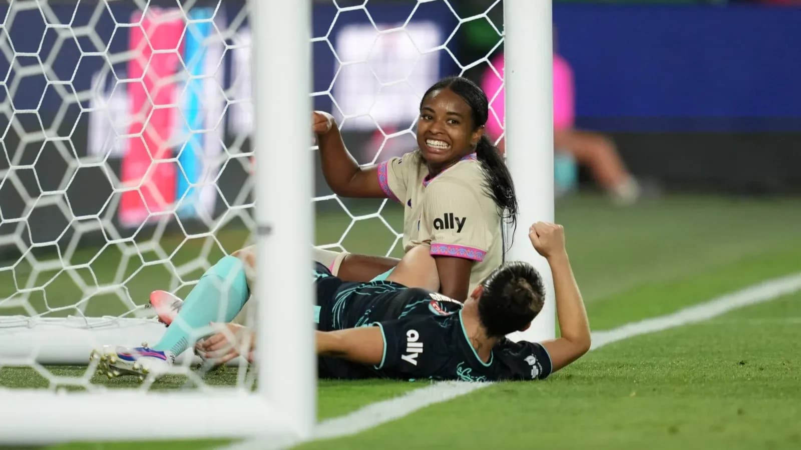 Players celebrating near the goal during match Players celebrating near the goal during match