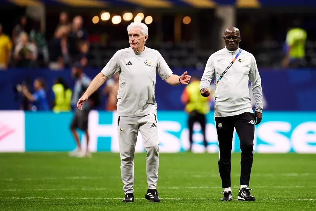 Coaches walking on the pitch before the match Coaches walking on the pitch before the match