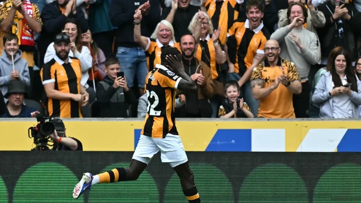 Player celebrating in front of cheering crowd Player celebrating in front of cheering crowd
