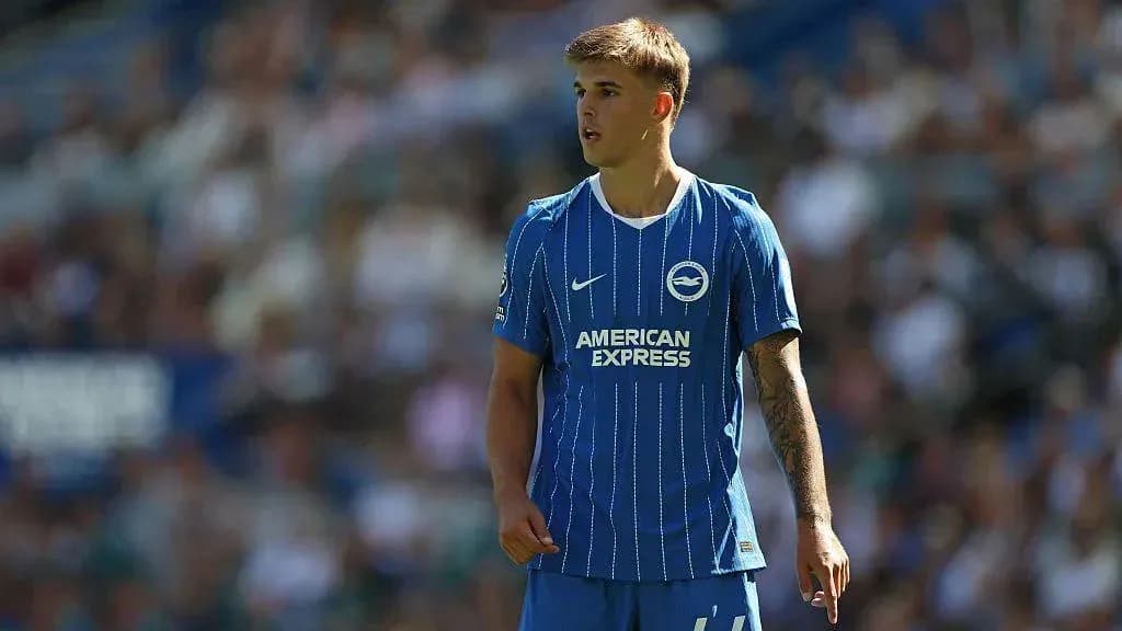 Player in blue Brighton kit on the field Player in blue Brighton kit on the field