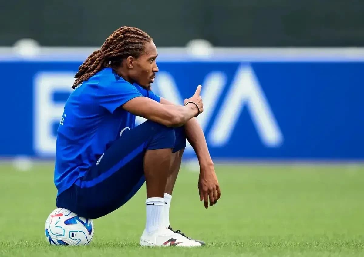 Player sitting on ball during training session Player sitting on ball during training session