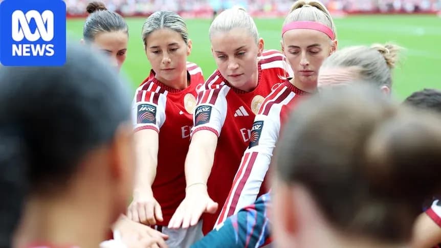 Players huddling before the match in team uniforms Players huddling before the match in team uniforms