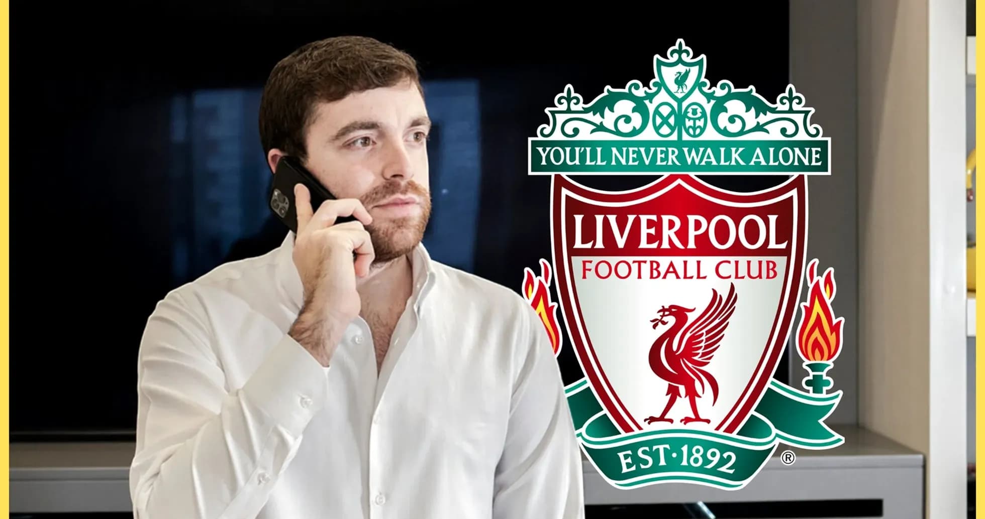 Person talking on phone near Liverpool FC logo Person talking on phone near Liverpool FC logo