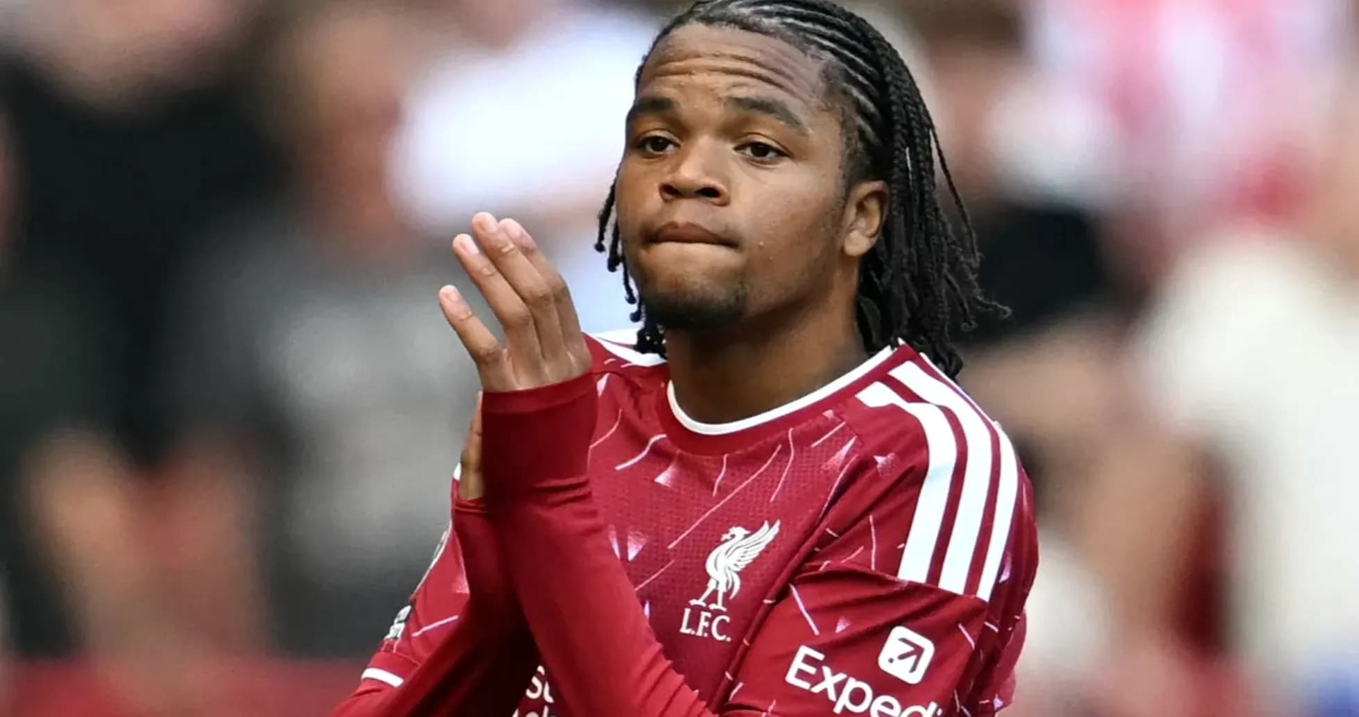 Player in Liverpool jersey clapping to crowd Player in Liverpool jersey clapping to crowd