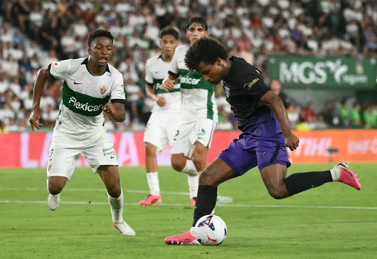 Player dribbling the ball during a match Player dribbling the ball during a match