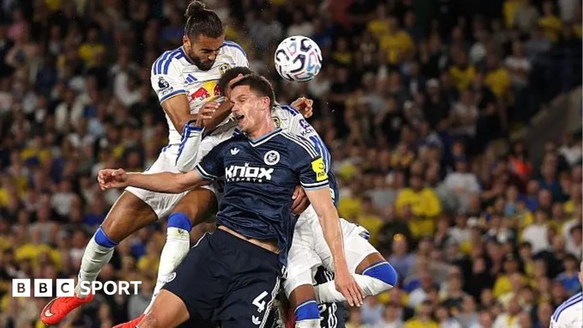 Players contesting for the ball during a match Players contesting for the ball during a match