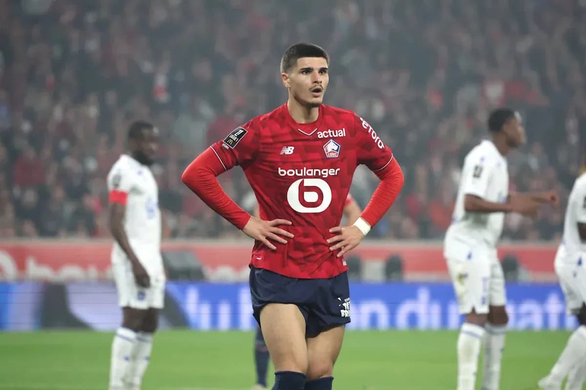 Lille player with hands on hips during match Lille player with hands on hips during match