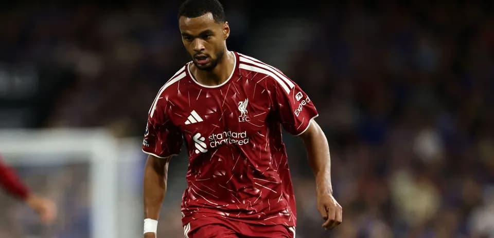 Player in Liverpool kit running during match Player in Liverpool kit running during match
