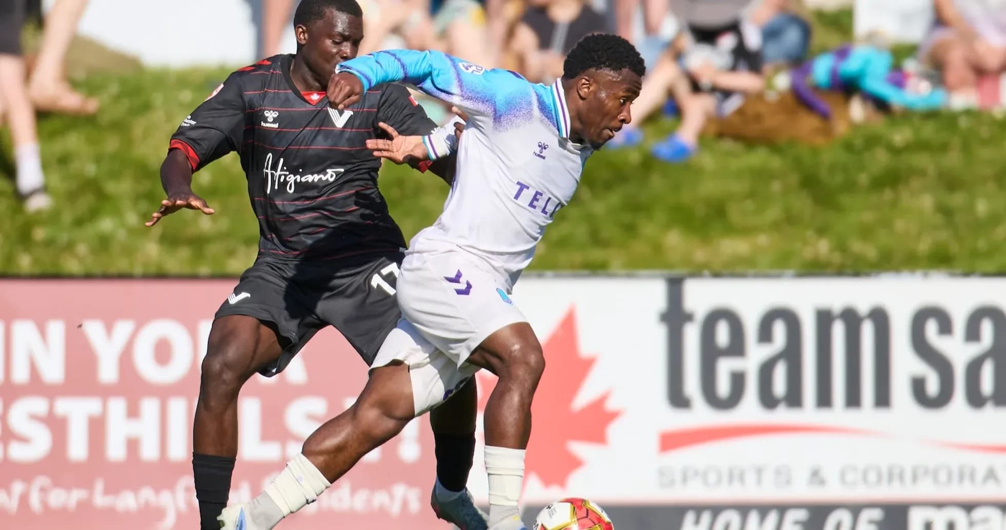 Player dribbling past opponent during match Player dribbling past opponent during match